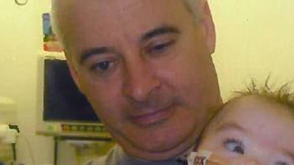 Handout photo from 2011 of murdered republican Kevin McGuigan with his grandson Ollie. File photograph: Family handout/PSNI/PA Wire