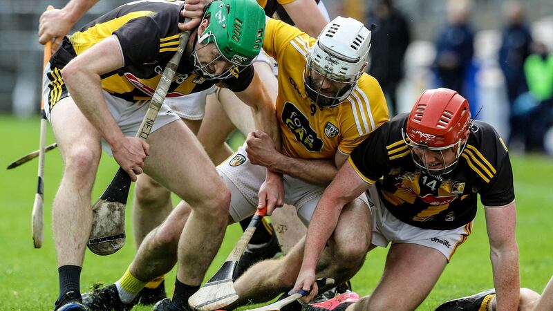 Kilkenny’s Joey Holden and Adrian Mullen tussle with Antrim’s Neil McManus. Photograph: Lorraine O’Sullivan/Inpho