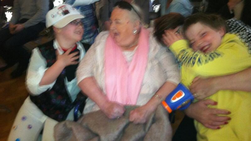 Mildred Kennedy with her  grandchildren: Her husband awoke one night to find she had fallen against the sink in the corner of the room. Splitting her skull wide open.