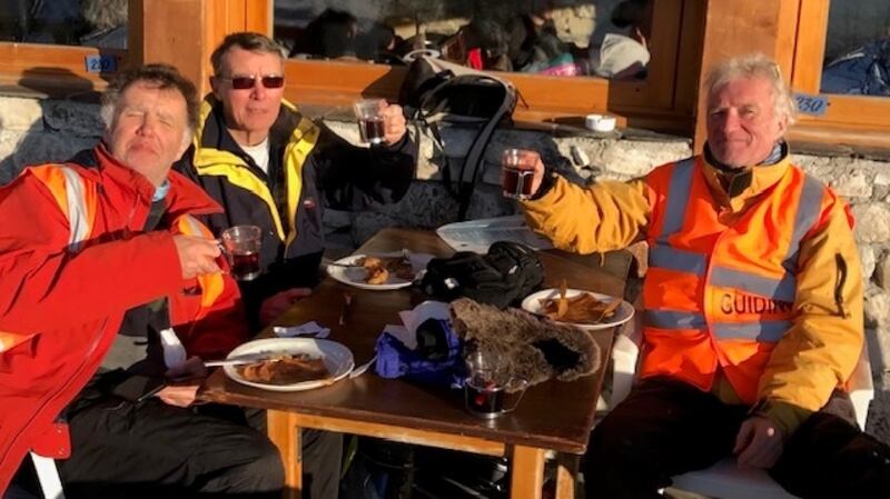 Peter Gorey (left) enjoys a well deserved pancake and vin chaud with his guides Roger Jones (centre) and Richard Waters (right).