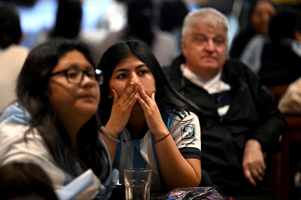 Football fans of Argentina watch the Argentina match in Buenos Aires. Photograph: Luis Robayo/AFP via Getty