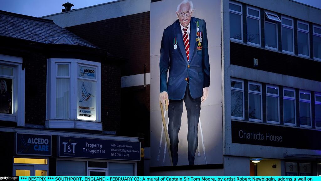 A mural of the late Sir Tom Moore, by artist Robert Newbiggin, adorns a wall in Southport, England. Photograph: Christopher Furlong/Getty Images