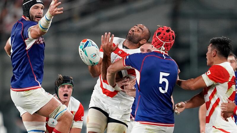 Japan’s Michael Leitch challenges for the ball with Russia’s Bogan Fedotko (R). Photograph: Franck Robichon/EPA