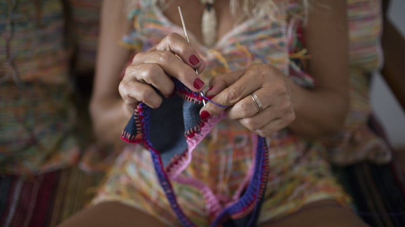 Ferrarini crochets a bikini at her home in Brazil. Photograph: Dado Galdieri/New York Times
