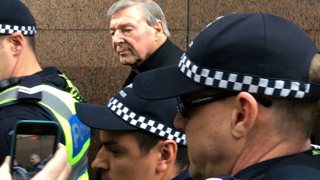 Cardinal George Pell, rear centre, leaves Melbourne Magistrates’ Court on Wednesday. Photograph: Kristen Gelineau/AP