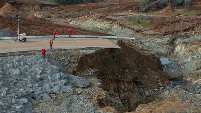 Crews inspect and evaluate the erosion just below the Lake Oroville emergency spillway on Tuesday. Photograph: Kelly M Grow/Reuters