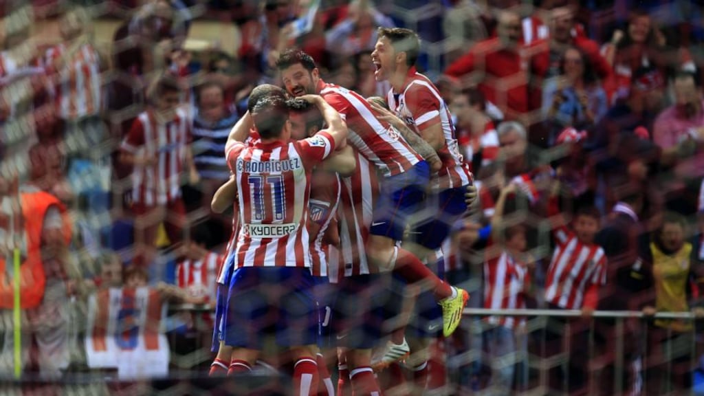 Atletico Madrid’s players celebrate the opening goal against Villarreal. Photograph: EPA