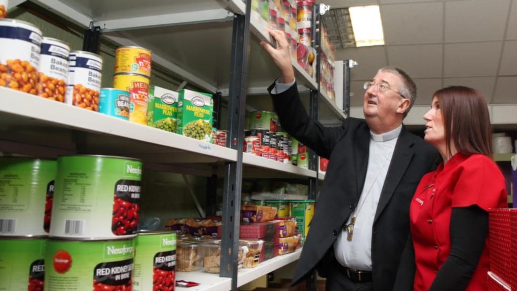 Archbishop Diarmuid Martin at the Crosscare food bank this morning talking with foodbank manager Valerie Cummins. Photograph: John Mc Elroy.