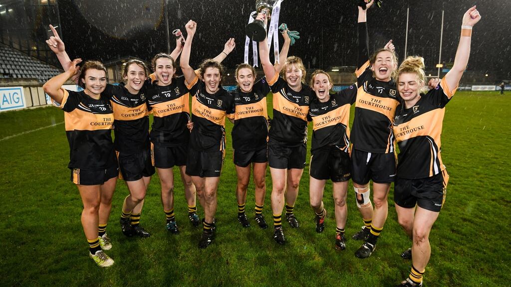 Mourneabbey players celebrate with the Dolores Tyrrell Memorial Cup after beating Foxrock-Cabinteely in the All-Ireland Ladies Football Senior Club Championship Final   at Parnell Park in Dublin. Photograph: Stephen McCarthy/Sportsfile