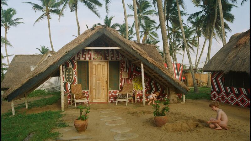 Kate Eshelby’s sons Zac and Archie play in front of one of the houses (one of the honeymoon suites) at Meet Me There in Keta.