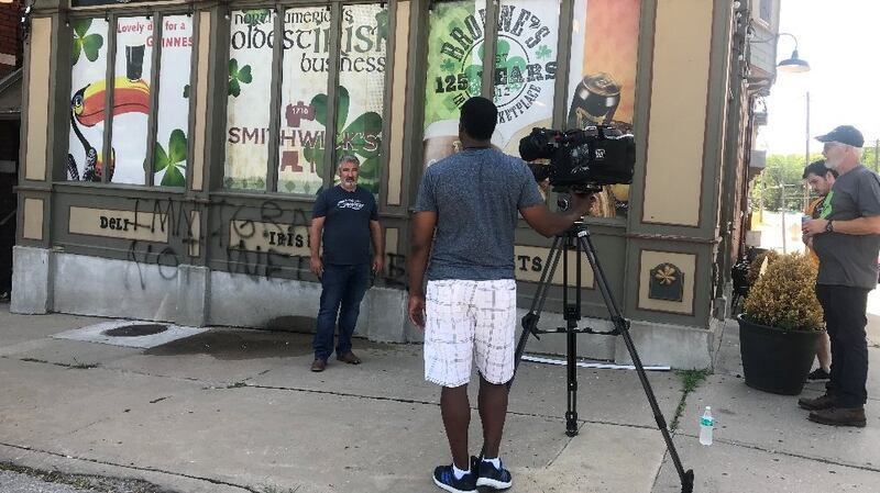 George Vial, a native of Co Donegal, who works at Brownes is interviewed about the anti-immigrant graffiti. Photograph: Brownes Irish Market