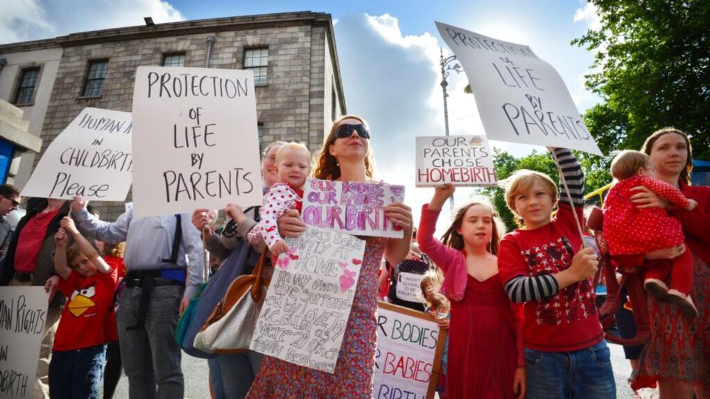 Supporters of Aja Teehan and her husband Charles Brand outside the Four Courts last month before Ms Teehan lost a High Court case relating to having a home birth. Photograph: Alan Betson/The Irish Times
