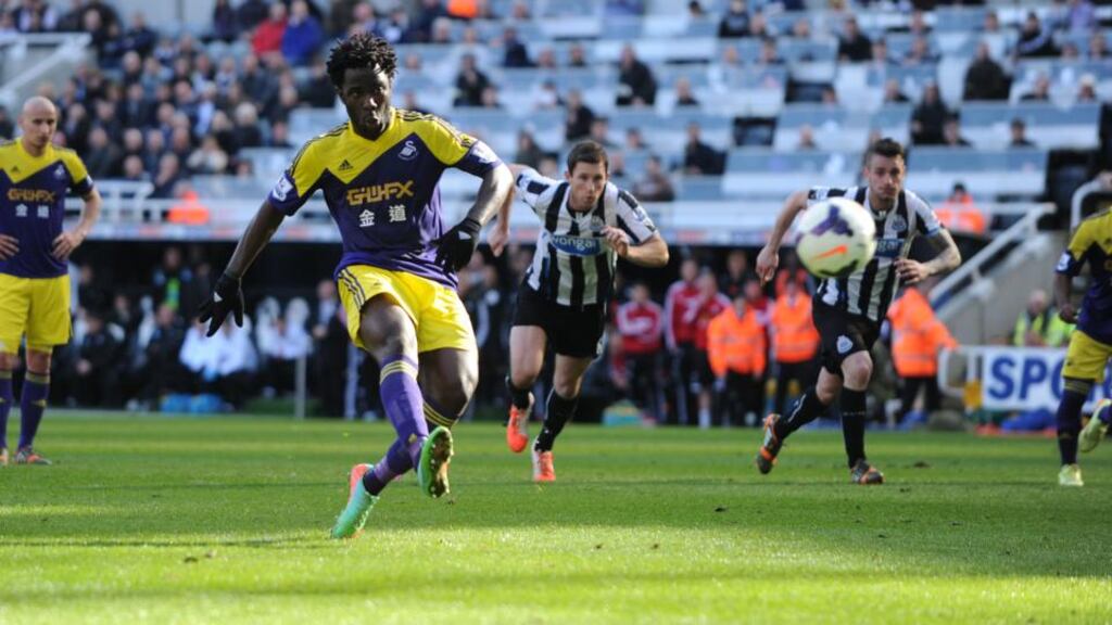 Swansea’s Wilfried Bony fires home an injury-time penalty to score his second and the winning goal against Newcastle in the Premier League clash at St James’ Park. Photograph: Owen Humphreys/PA