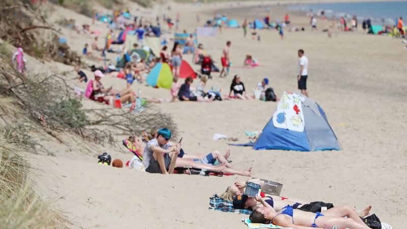 Sun bathers on the beach in Brittas Bay Co Wicklow. Photograph: credit should read: Niall Carson/PA Wire
