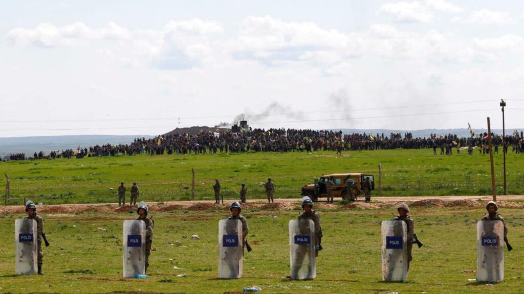 Turkish soldiers secure the border line between Turkey and Syria. Photograph: Umit Bektas/Reuters.