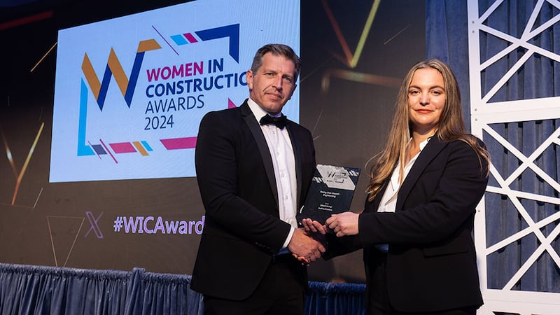 Enda Murphy, managing director cleanrooms and pre-construction, Ardmac, presents the rising star award - engineering to Audrey Dantras, Elliott Group