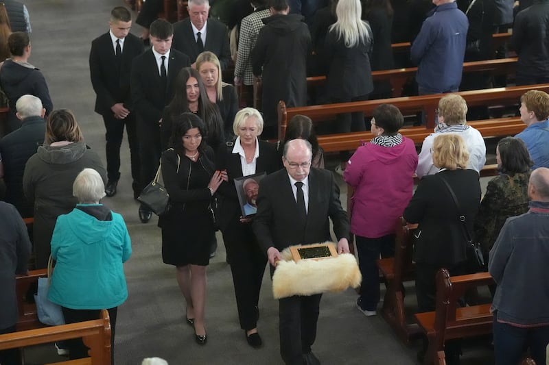 Mourners proceed through the Holy Cross Church in Kenmare following Michael Gaine's funeral. Photograph: Niall Carson/PA