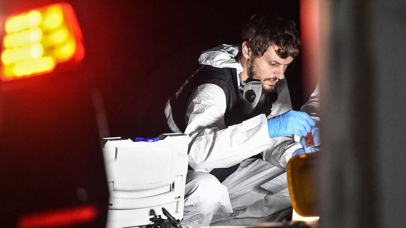 A Turkish forensic police officer searches for evidence. Photograph: Ozan Koze/AFP