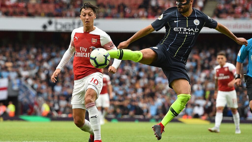 Arsenal’s Mezut Özil vies with Manchester City’s Ilkay Gündogan at the Emirates Stadium in London on Sunday. Photograph: Glyn Kirk/AFP/Getty Images