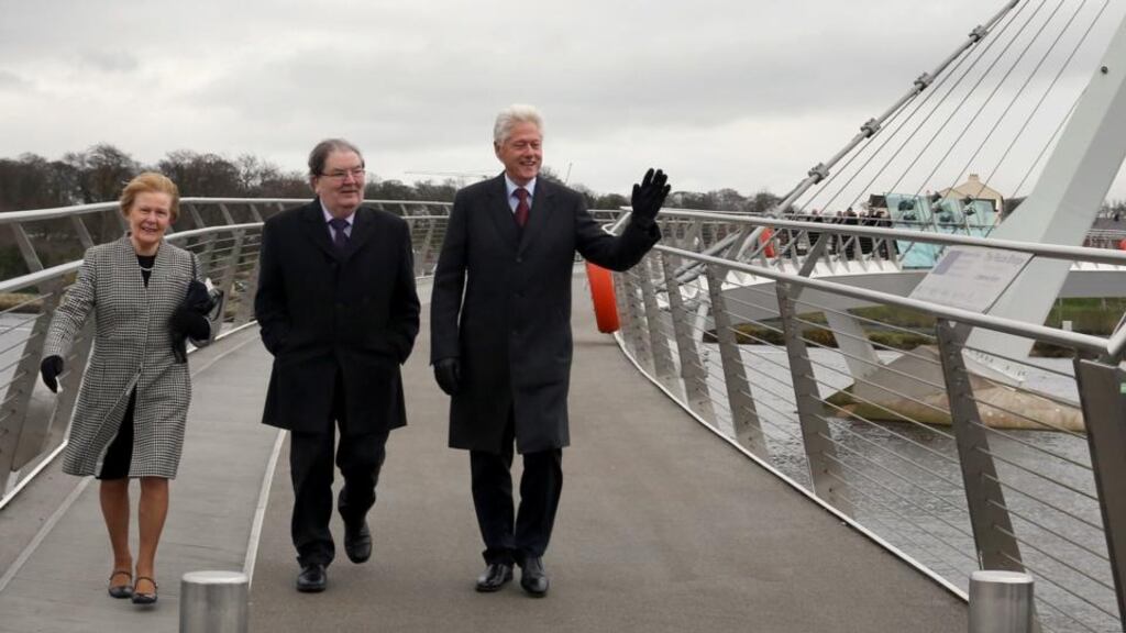 Former US president Bill Clinton with former SDLP leader John Hume and Mr Hume’s wife, Pat, as they walk the Peace Bridge in Derry yesterday. Photograph: Paul Faith/PA Wire