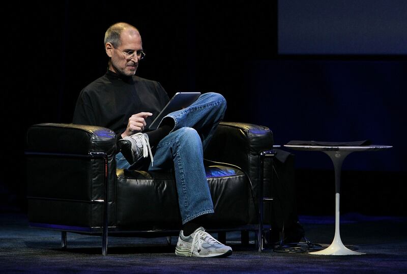 Late Apple fouder Steve Jobs demonstrates a new iPad as he speaks during an Apple Special Event at Yerba Buena Center for the Arts on January 27th, 2010 in San Francisco, California. Mr Jobs died on October 6th, 2011 from a rare form of pancreatic cancer and other health issues Photograph: Justin Sullivan/Getty