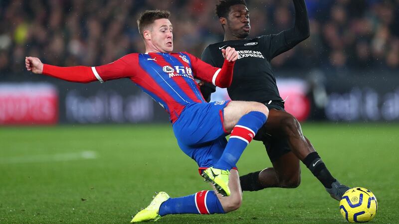 Crystal Palace’s James McCarthy tackles Yves Bissouma of Brighton. Photograph: Clive Rose/Getty Images
