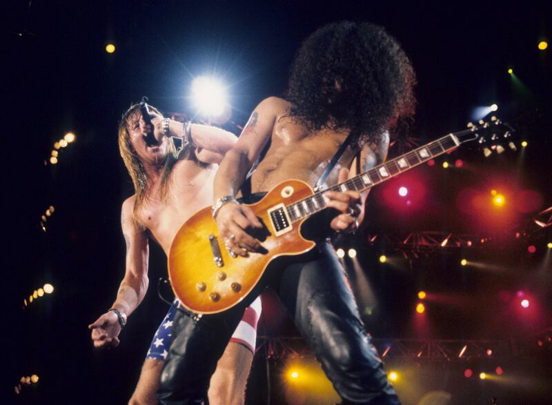 Guns N Roses: Axl Rose and Slash perform in 1991. Photograph: Kevin Mazur/WireImage via Getty