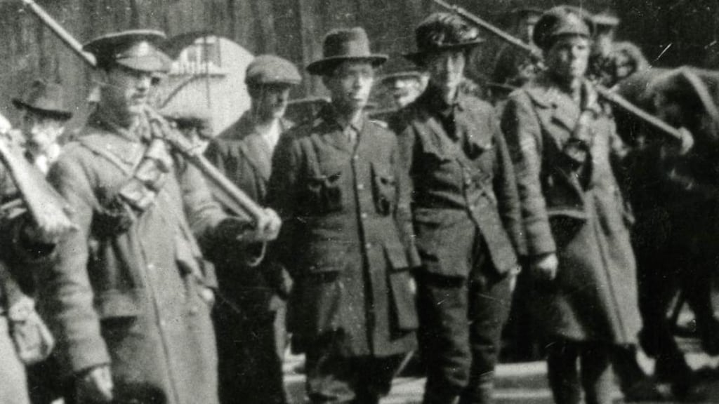 Michael Mallin, who was executed, and Countess Markievicz being escorted away by government troops. Photograph: Courtesy of National Museum of Ireland