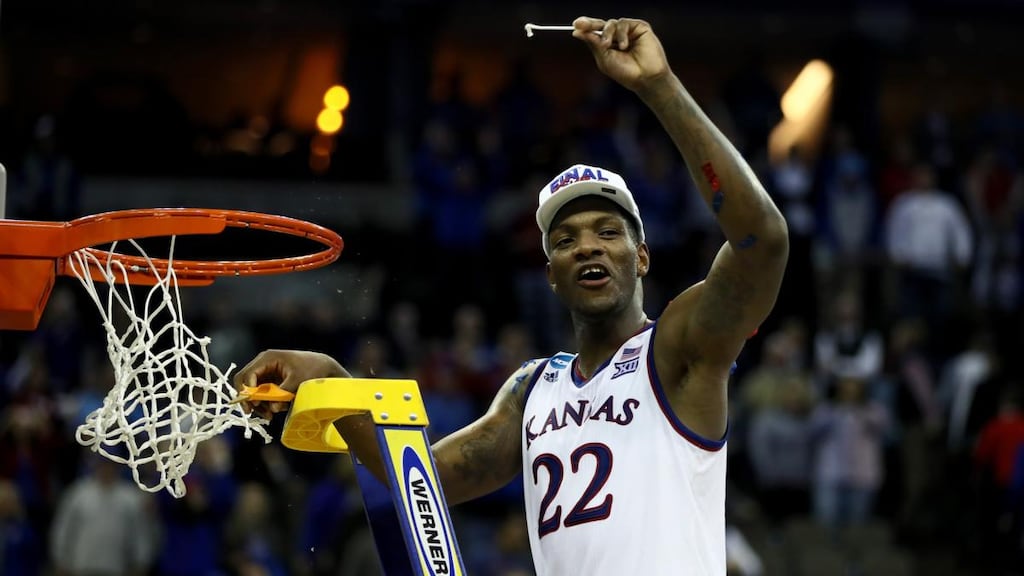 Kansas Jayhawks’ Silvio de Sousa celebrates cutting down the net after defeating the Duke Blue Devils in the 2018 NCAA Men’s Basketball Tournament Midwest Regional at in Omaha, Nebraska. Photograph: Jamie Squire/Getty Images
