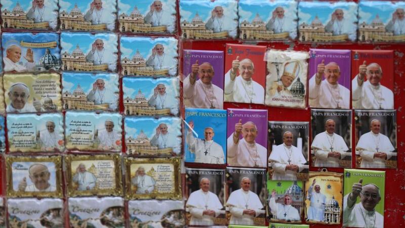 Gifts for sale as pilgrims from around the world arrive at St Peter’s Square in Vatican City to see the canonisation of Popes John XXIII and John Paul II. Photograph: Niall Carson/PA Wire