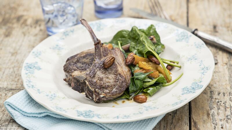 Grilled lamb chops with spinach, cumin, almonds and apricots. Photograph: Harry Weir