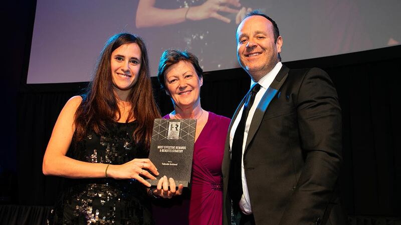 Rose Leonard, Head of Corporate Distribution & Customer Relationships, Zurich Life, presents the Most Effective Rewards & Benefits Strategy award to Lucila Torres & Kevin Keegan, Takeda Ireland.