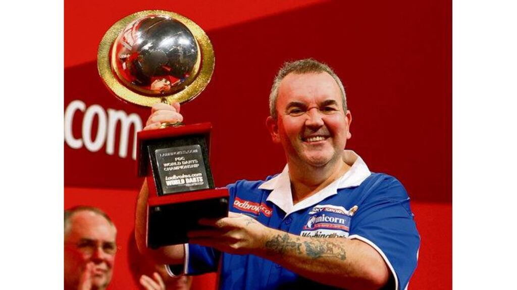 Phil Taylor after winning the world title for a record 15th time by beating Simon Whitlock of Australia in the final on Sunday night. (Photograph: John Gichigi/Getty Images).