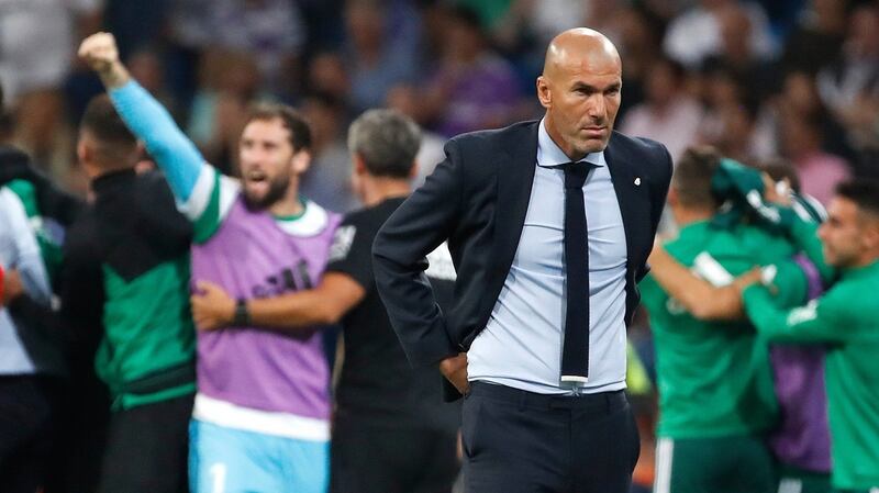 Real Madrid boss Zinedine Zidane reacts after Real Betis score their injury-time goal. Photograph: Juanjo Martin/EPA