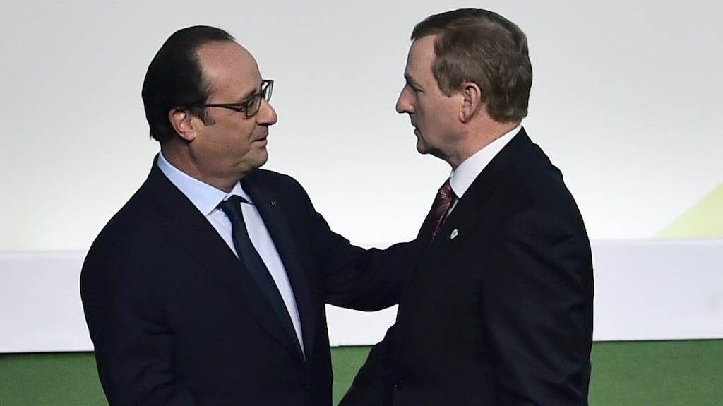 Taoiseach Enda Kenny shakes hands with French president Francois Hollande upon his arrival for the opening of the UN conference on climate change, on November 30th, 2015 at Le Bourget, on the outskirts of the French capital Paris. Photograph: Loic Venance/AFP/Getty Images