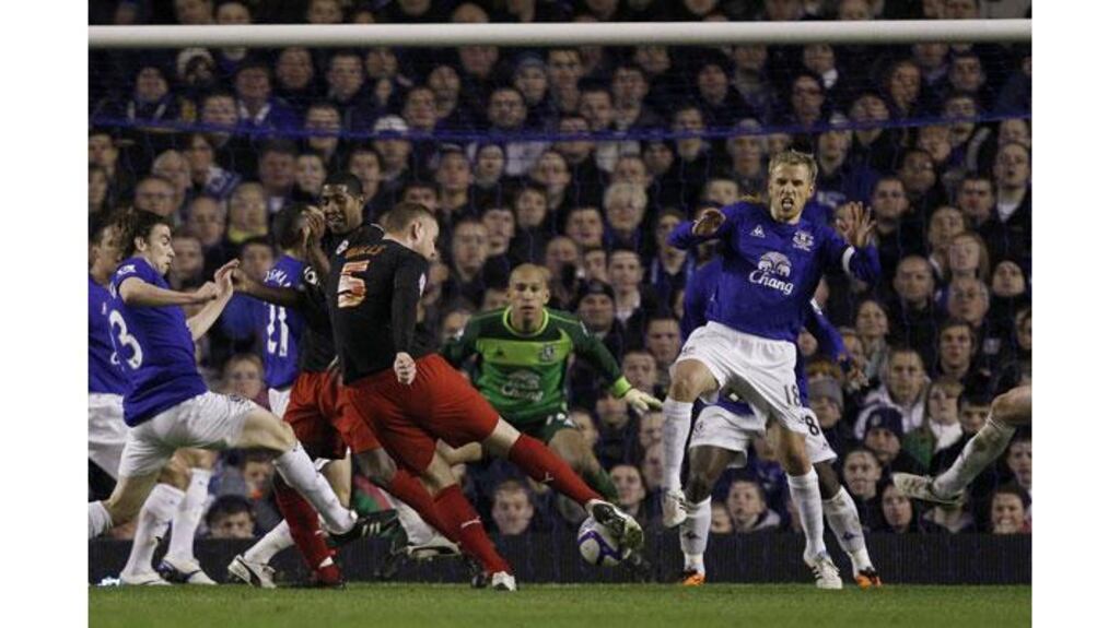 Reading's Matt Mills (C) shoots to score the winner against Everton during their English FA Cup match at Goodison Park. Photograph: Phil Noble/Reuters