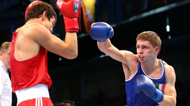 Donegal middleweight  Jason Quigley, right, in action against  Artem Chebotarev of Russia in their World Championships  semi-final bout in Almaty, Kazakhstan. Photograph: Cathal Noonan/Inpho