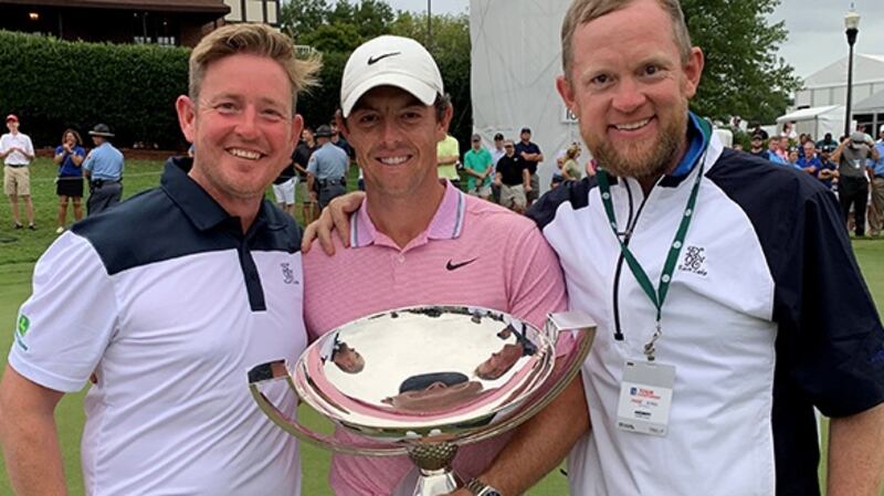 Eamonn McCarthy (right) with his friend Damien McConway from Co Derry  and Rory McIlroy at the PGA tour championship finals at East Lake Golf Club in Atlanta, Georgia,  which  McIlroy  won last year