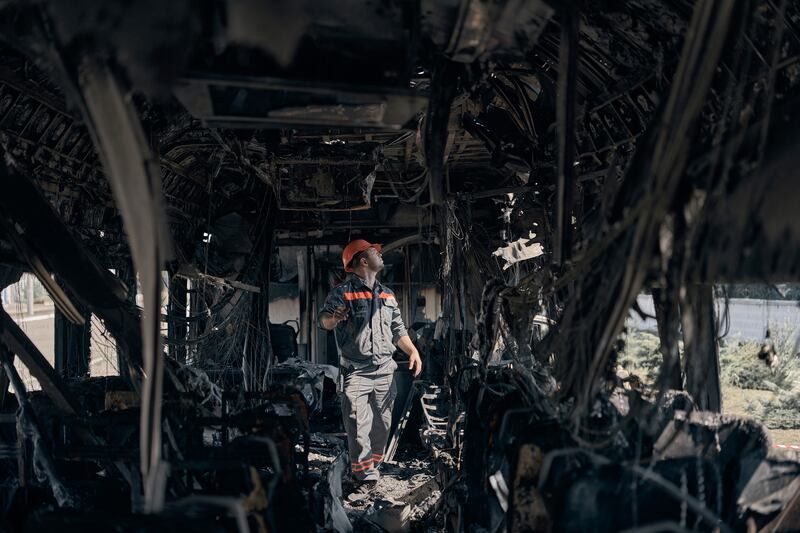 A Ukrainian railway worker inspects a train in Kyiv after it was struck by a Russian drone. Photograph: Kostiantyn Liberov/Libkos/Getty Images