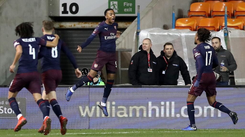 Joe Willock of Arsenal celebrates with teammates after scoring his team’s first goal during the FA Cup third round win over Blackpool. Photo: Mark Robinson/Getty Images