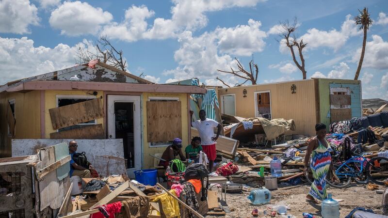Residents in the Pigeon Peas neighbourhood salvage belongings in Marsh Harbour, Bahamas. Photograph: Daniele Volpe/The New York Times