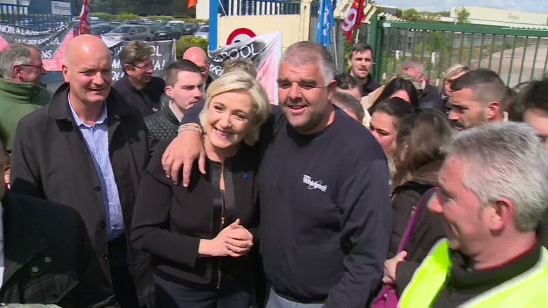 Far-right French presidential candidate Marine Le Pen is greeted by workers outside the  Whirlpool factory in Amiens, France. Photograph:  AP Photo