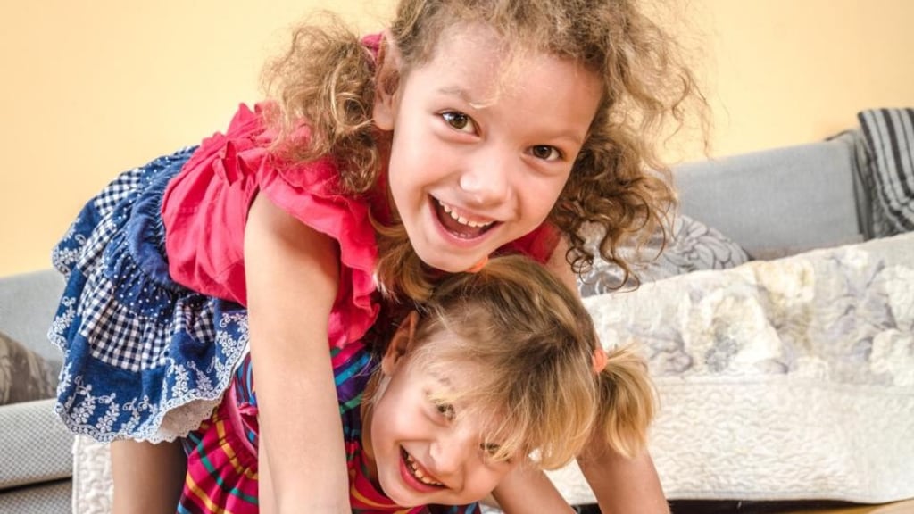 Your goal as a parent is to help both your daughters develop as unique individuals while supporting them to continue to have a good relationship with each other. Photograph: Thinkstock