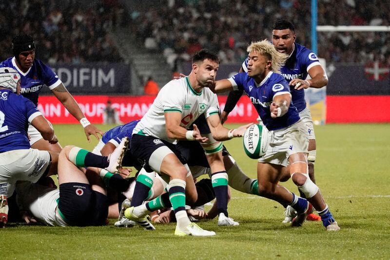 Conor Murray of Ireland under pressure from Jonathan Taumateine of Samoa. Photograph: Dave Winter/Inpho