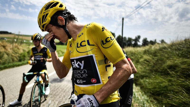 Team Sky’s Geraint Thomas cleans his eyes after tear gas was used during the protest. Photo: Marco Bertorello/Getty Images