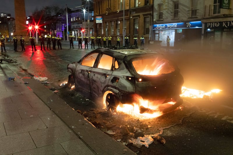 Major public disorder erupted in Dublin in the wake of a stabbing incident in which three children were injured, with clashes between groups and police on Parnell Street and O’Connell Street leaving one Garda injured and a number of Garda vehicles damaged. Photograph: Chris Maddaloni/The Irish Times
