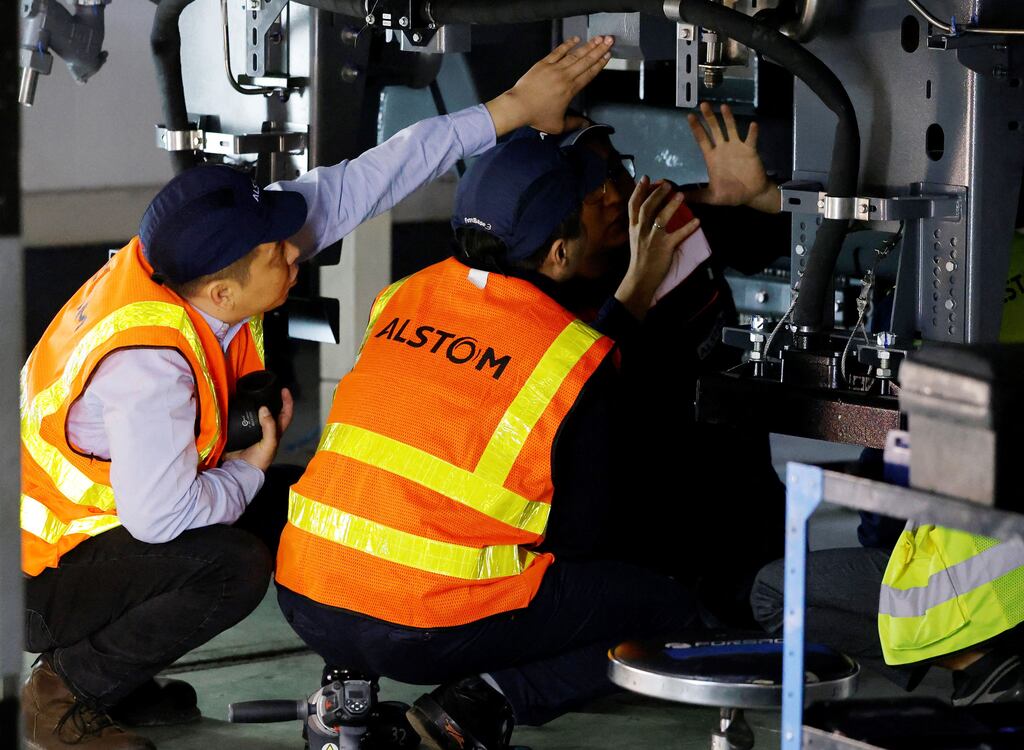 Alstom employees work in the locomotives assembly workshop. Alstom gained 5.6 per cent after the French train maker set terms of a planned €1 billion rights issue as part of broader actions to repair its finances. Photograph: Ludovic Marin/AFP via Getty Images