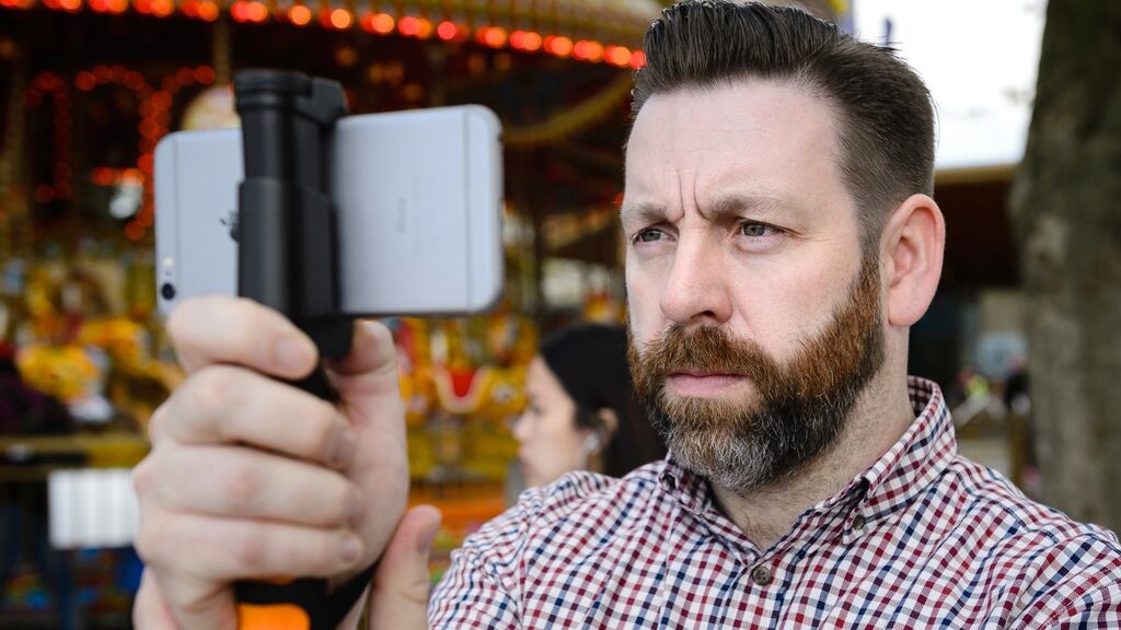 Photojournalist and filmmaker John D McHugh with the Verifeye Media iPhone camera app. He is the co-founder of Verifeye Media, a technology-driven visual news agency, representing freelance journalists and accidental eyewitnesses to breaking news events.