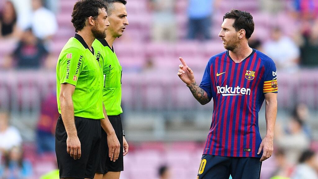 Lionel Messi of FC Barcelona argues with the referee Jaime Latre at the end of the match. Photograph: David Ramos/Getty Images