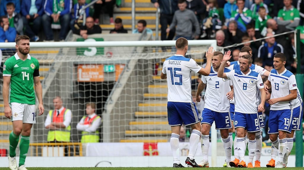 Bosnia and Herzegovina players celebrate scoring their second goal of the game as Northern Ireland’s Stuart Dallas (left) looks on during the Uefa Nations League, League B Group Three match at Windsor Park, Belfast. Photo: Brian Lawless/PA Wire